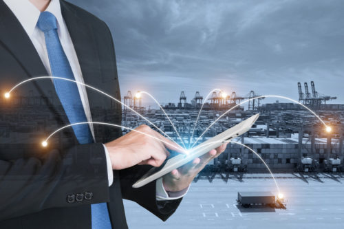 66155344_pic Double exposure of businessman hand holding digital tablet assistance control logistics system use for import, export and logistics background